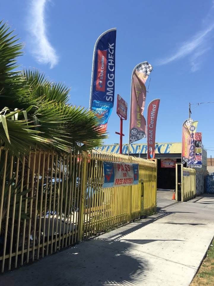 Service flags and shop entrance along S Figueroa St